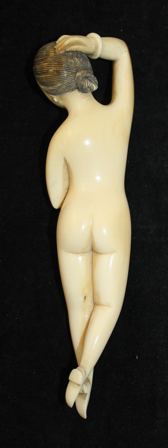 A Chinese ivory medicine figure of a nude woman, 19th century, 15cm